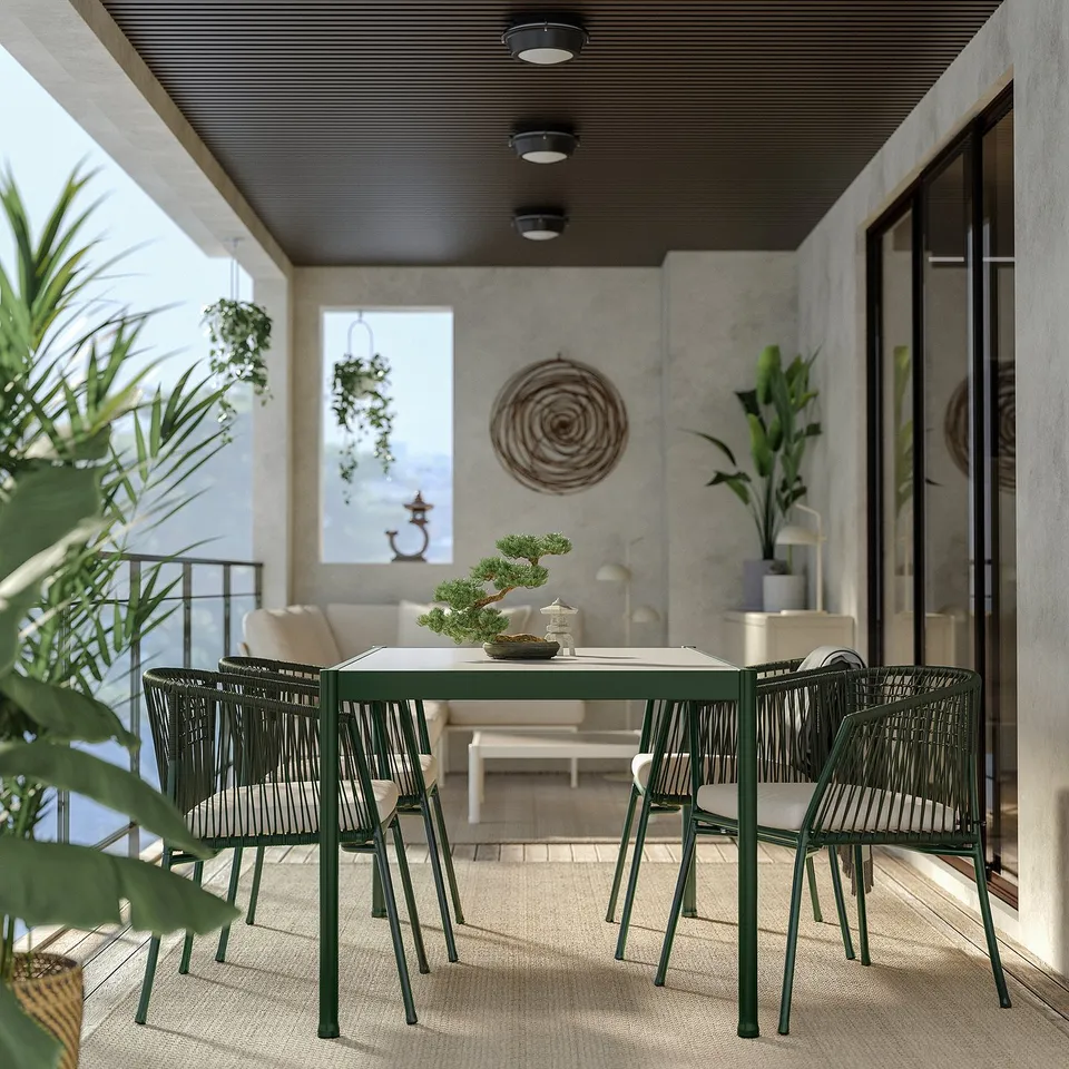 Modern outdoor dining set with green metal table and rope chairs, perfect for balconies.