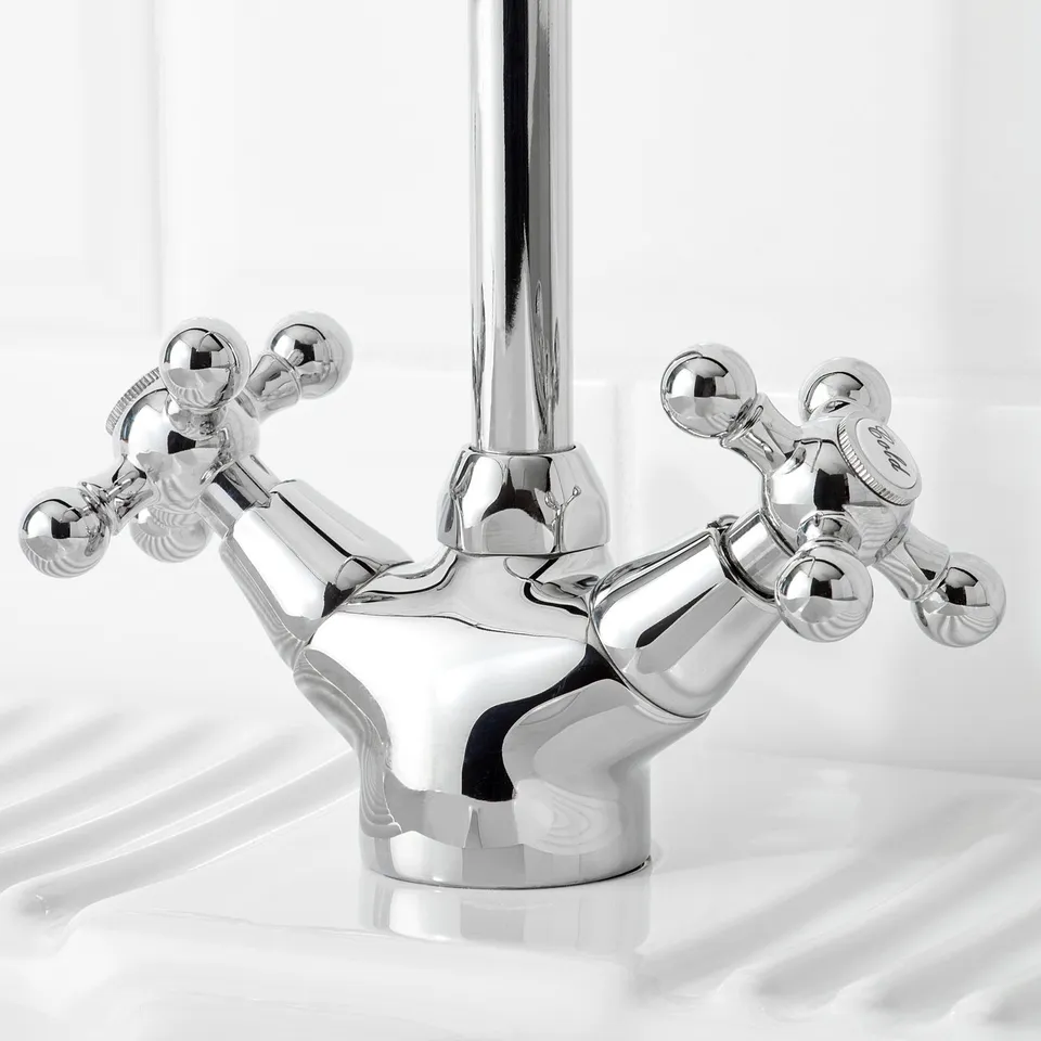 Polished chrome tap, sleek design, durable brass finish, high-quality craftsmanship.