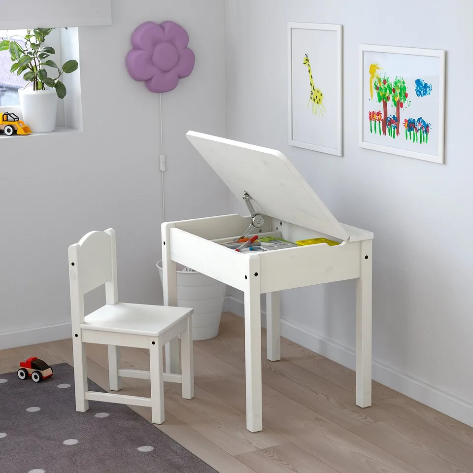 SUNDVIK kids white desk and chair. Small, bright, wood, storage within, fits corner.