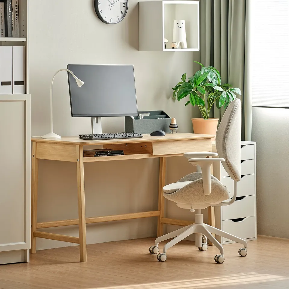 BETESHÄST wooden desk with drawer, chair, plant, bookshelf.