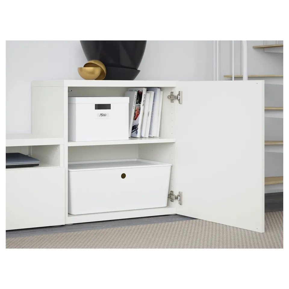 White BESTÅ tv storage with shelves, boxes, and drawer open. Adjustable shelves, cable management, and push-open drawer.