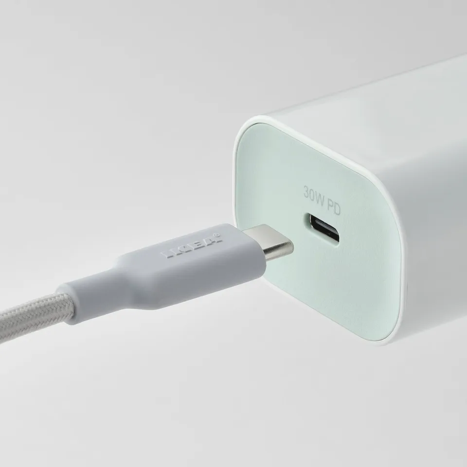 White usb-c charger labelled 30w pd with braided grey usb-c cable, demonstrating compatibility with various devices.
