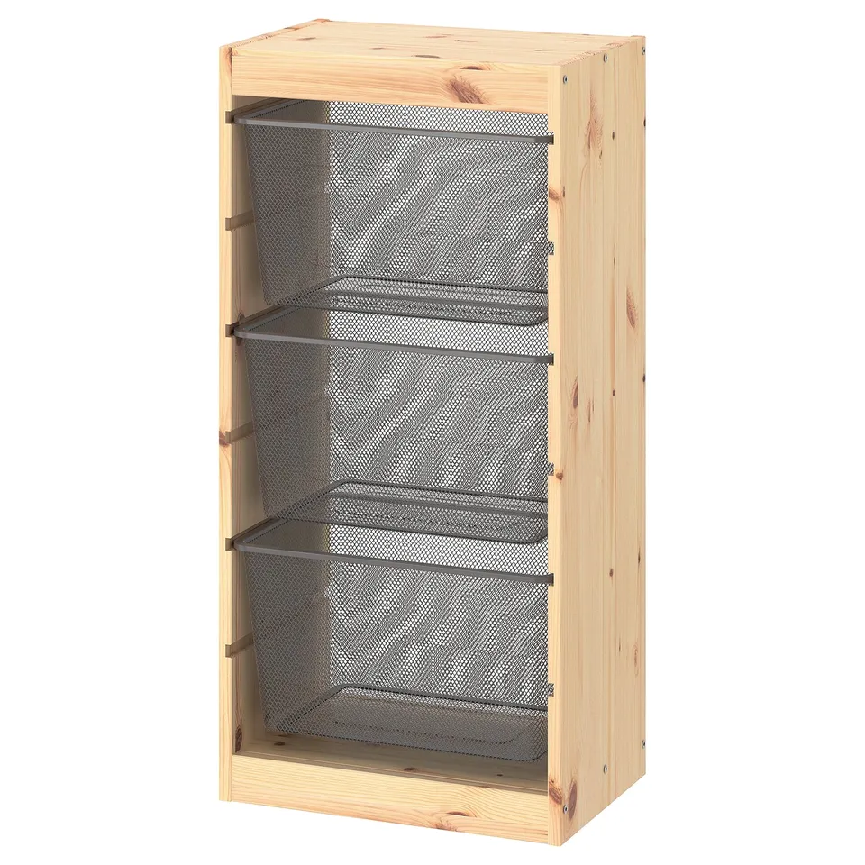 A TROFAST light pine wooden storage unit with three mesh shelves. The design is modern and spacious, ideal for organising various items.