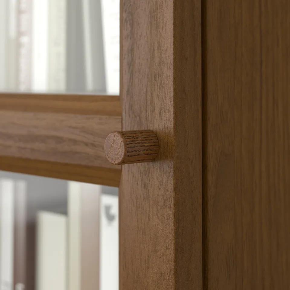 Wooden door with cylindrical handle, smooth finish, natural grain visible.