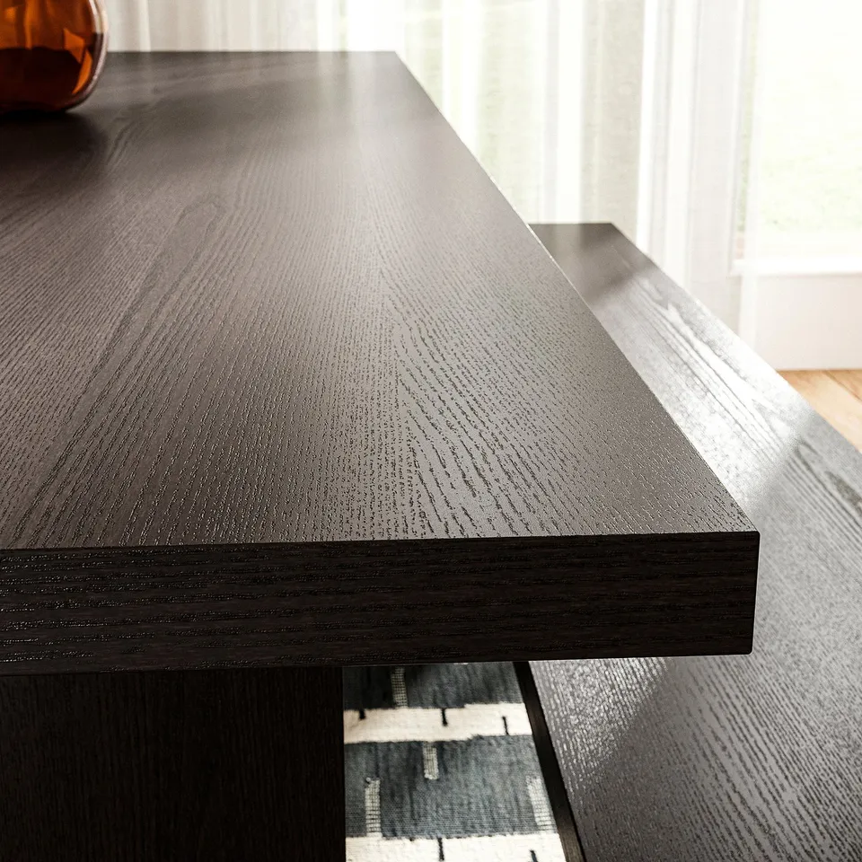Dark wooden table with smooth, even finish showcasing natural wood grain texture.