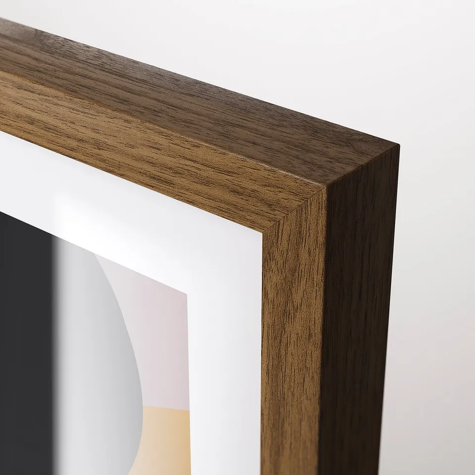 A close-up of a modern, well-constructed wooden picture frame with a smooth, polished finish and a sleek design.
