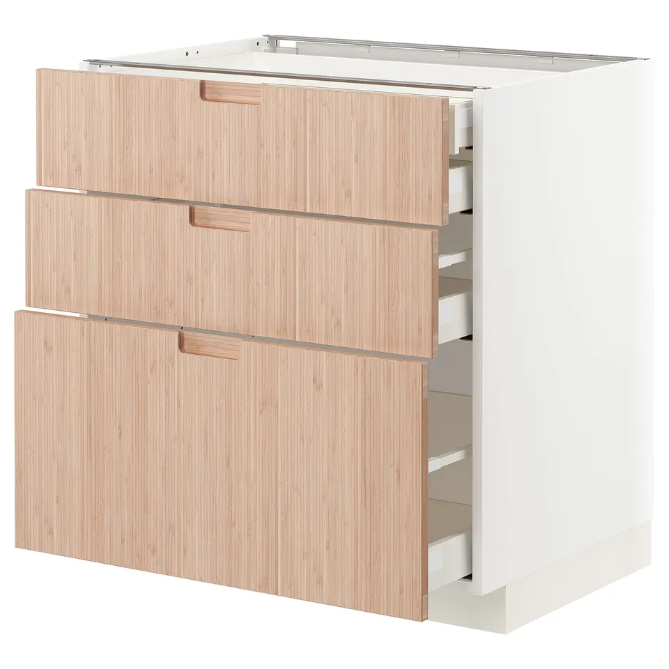 White METOD kitchen cabinet, light wooden finish, three drawers, natural bamboo.