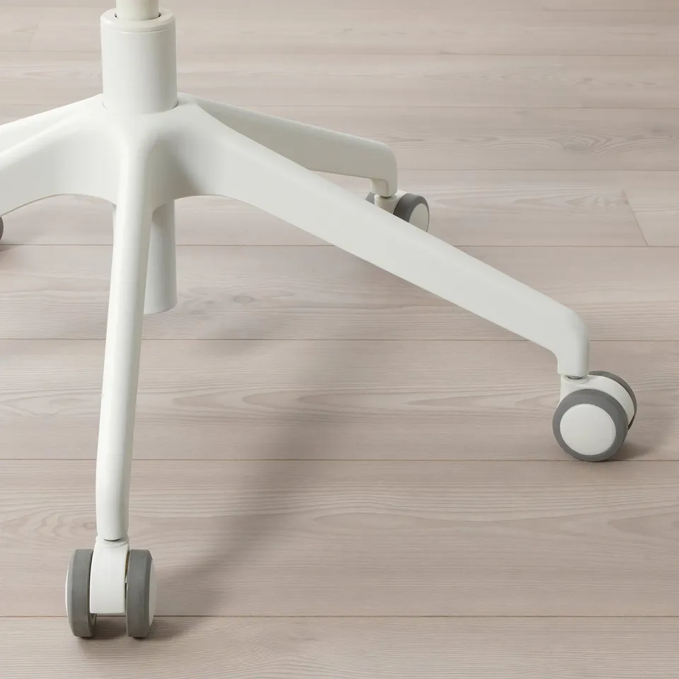 Ergonomic office chair leg with castors on smooth wood floor, emphasising stability and comfort.