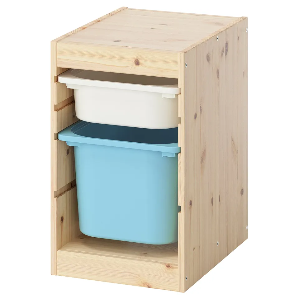 Ikea TROFAST storage unit with blue box, wooden frame, minimalist design.