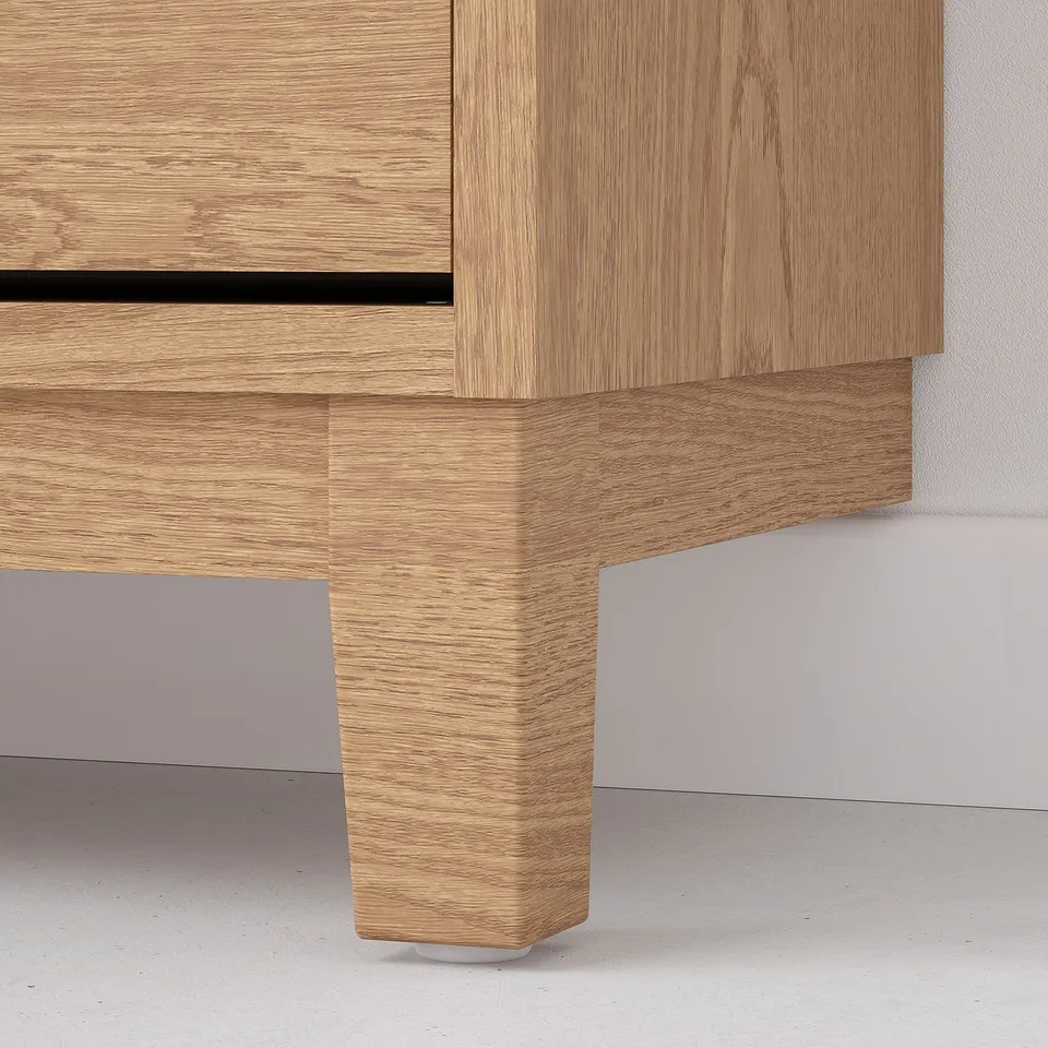 Modern light wood shoe cabinet by STÄLL; durable & stylish design with cut-out handles & sturdy legs.