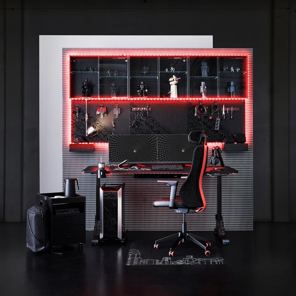 Modern gaming setup with red led lights, black furniture, and figurines; black chair and pc tower.