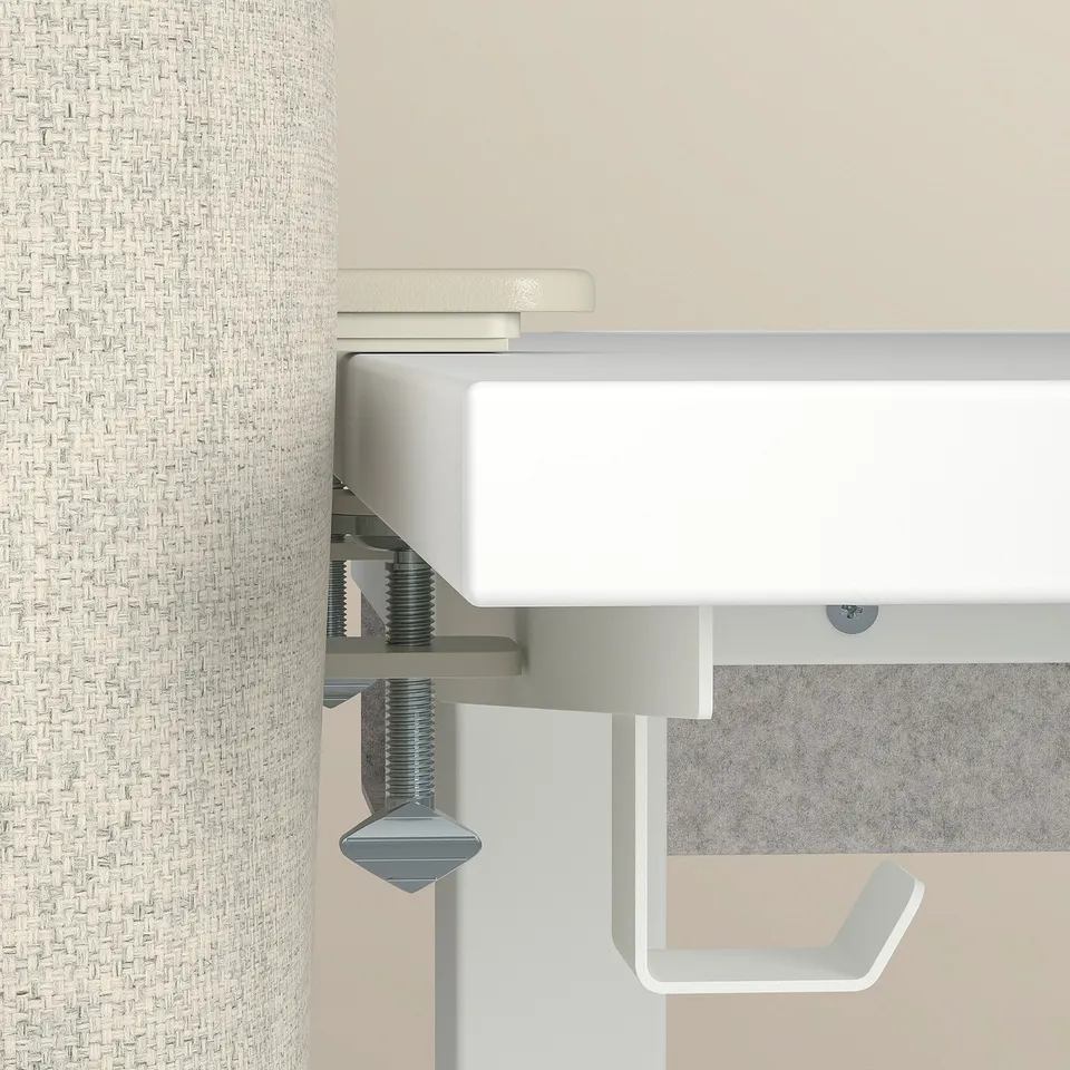 Close-up of a sleek, modern desk screen with durable materials and precise engineering, ensuring quality and functionality.