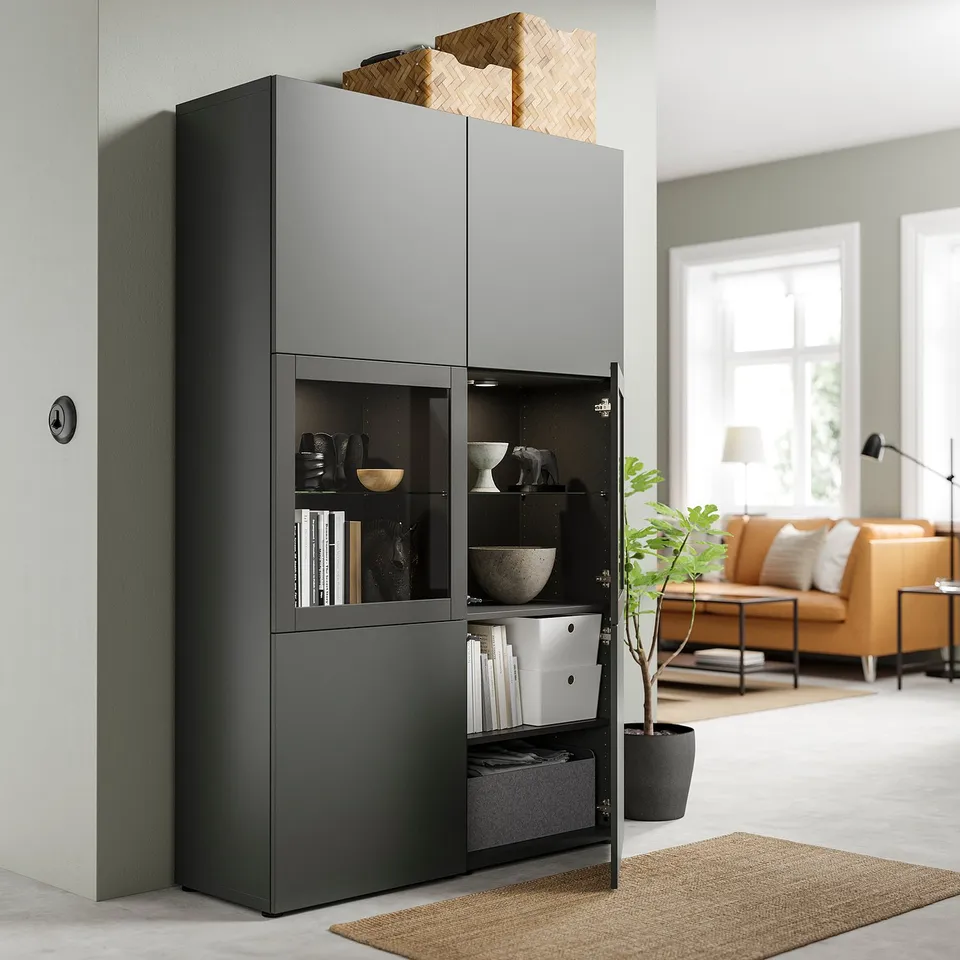 Modern living room with BESTÅ storage unit, open drawer, and cosy couch.