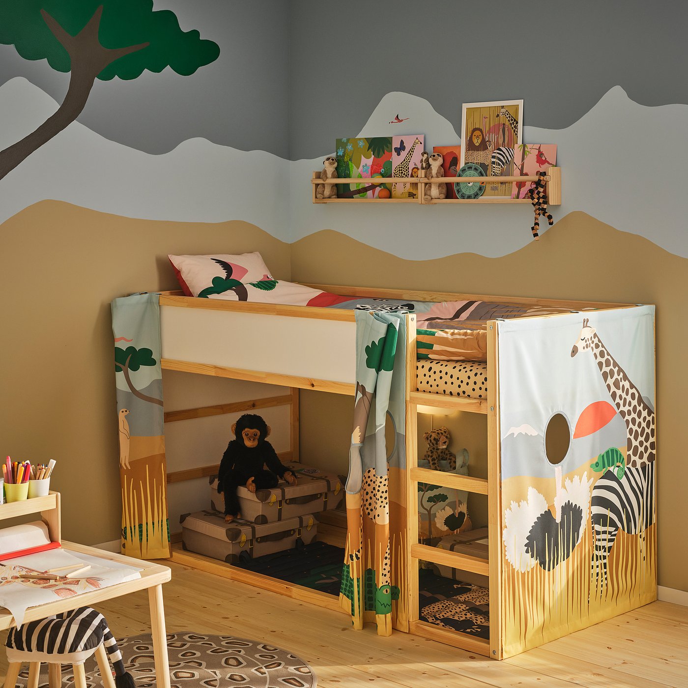 Kids room with wooden bunk bed, safari-themed curtains, stuffed toy, and study area.