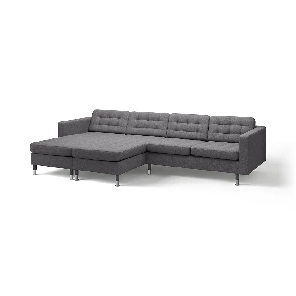A modern grey fabric l-shaped sofa with chrome legs, showcasing a sleek design.