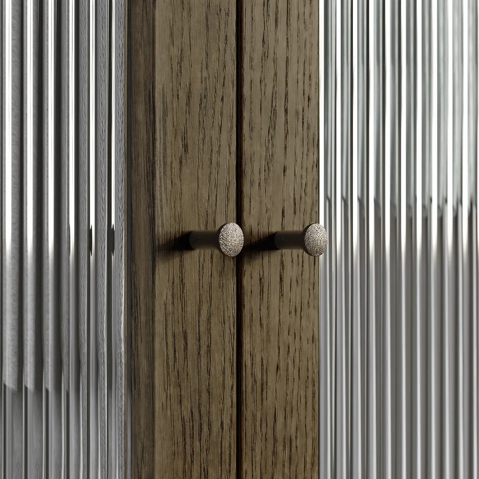 Wooden cabinet with round metal handle.