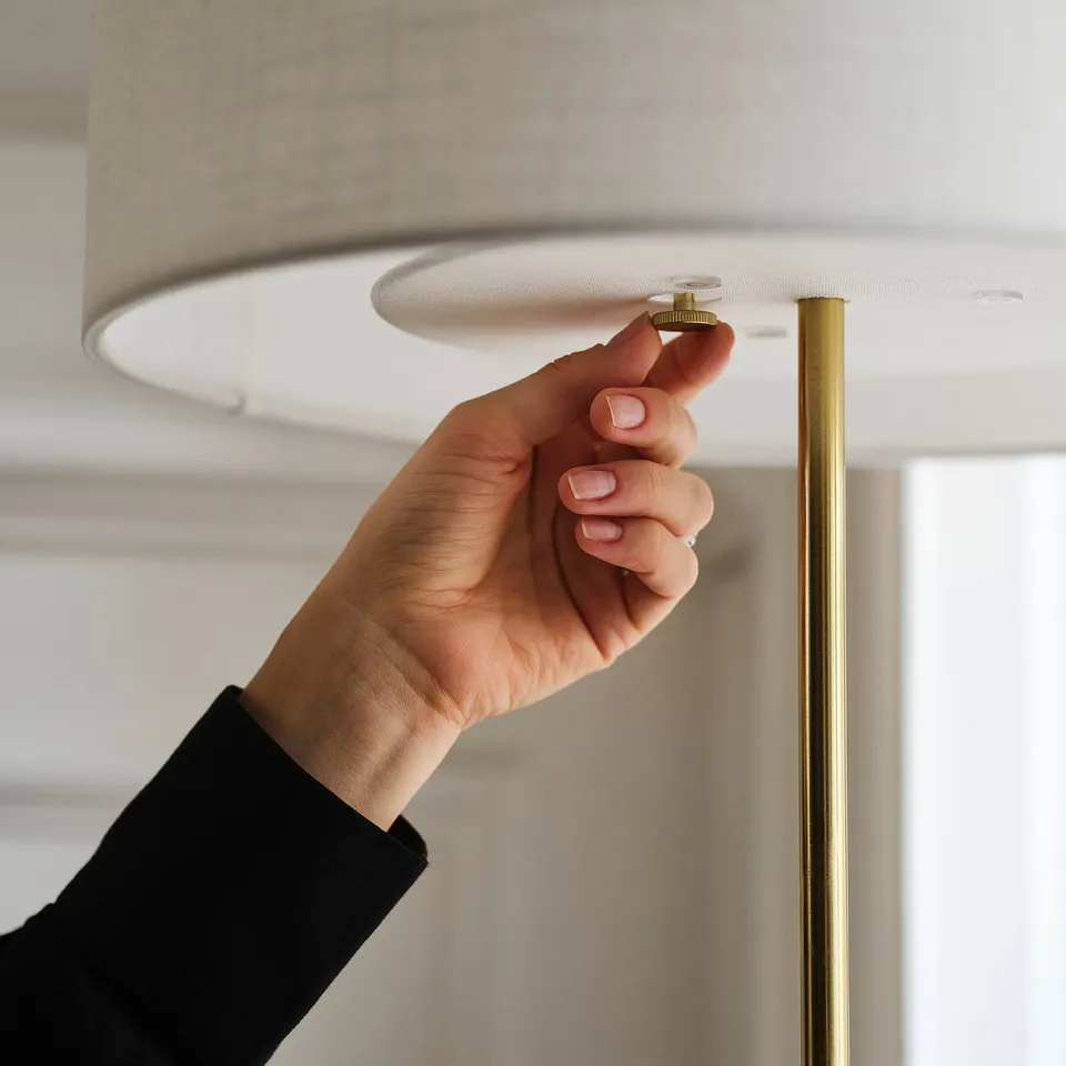 Adjusting lamp. Brass base, soft shade.