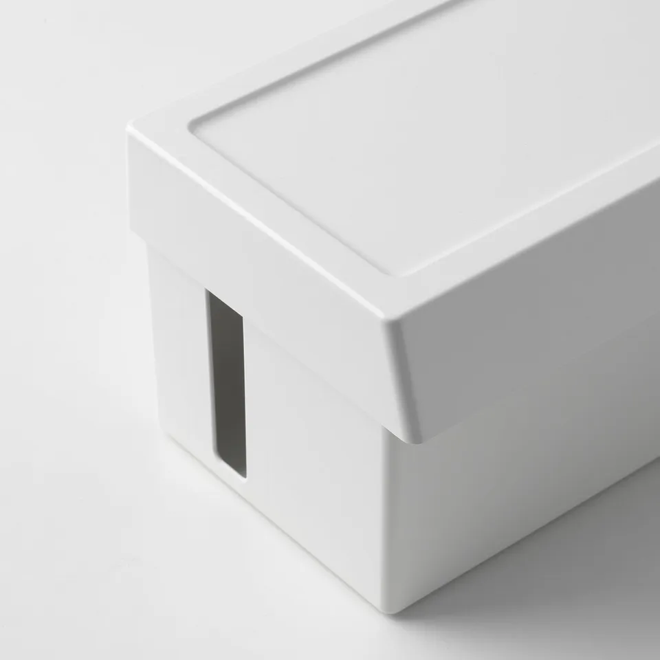 Modern white plastic box with minimalist design and cutout on side.
