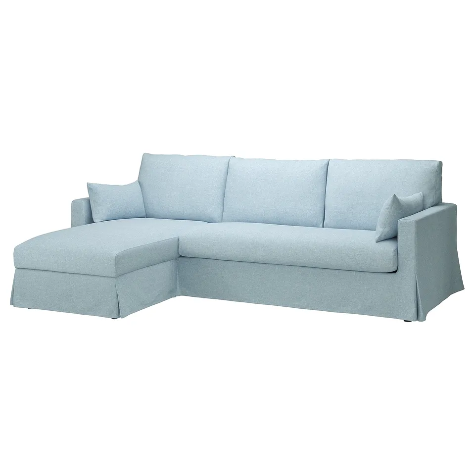Light blue l-shaped sofa, modern design, soft melange fabric, comfortable cushions.