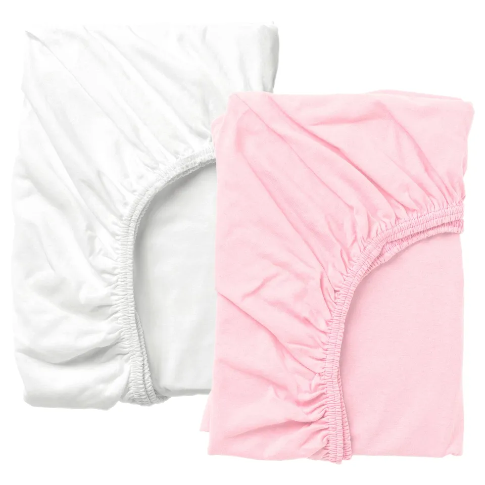 White and pink fitted sheets. They feature elastic edges for secure fit. Made of 100% cotton, they have a soft, natural look and feel.