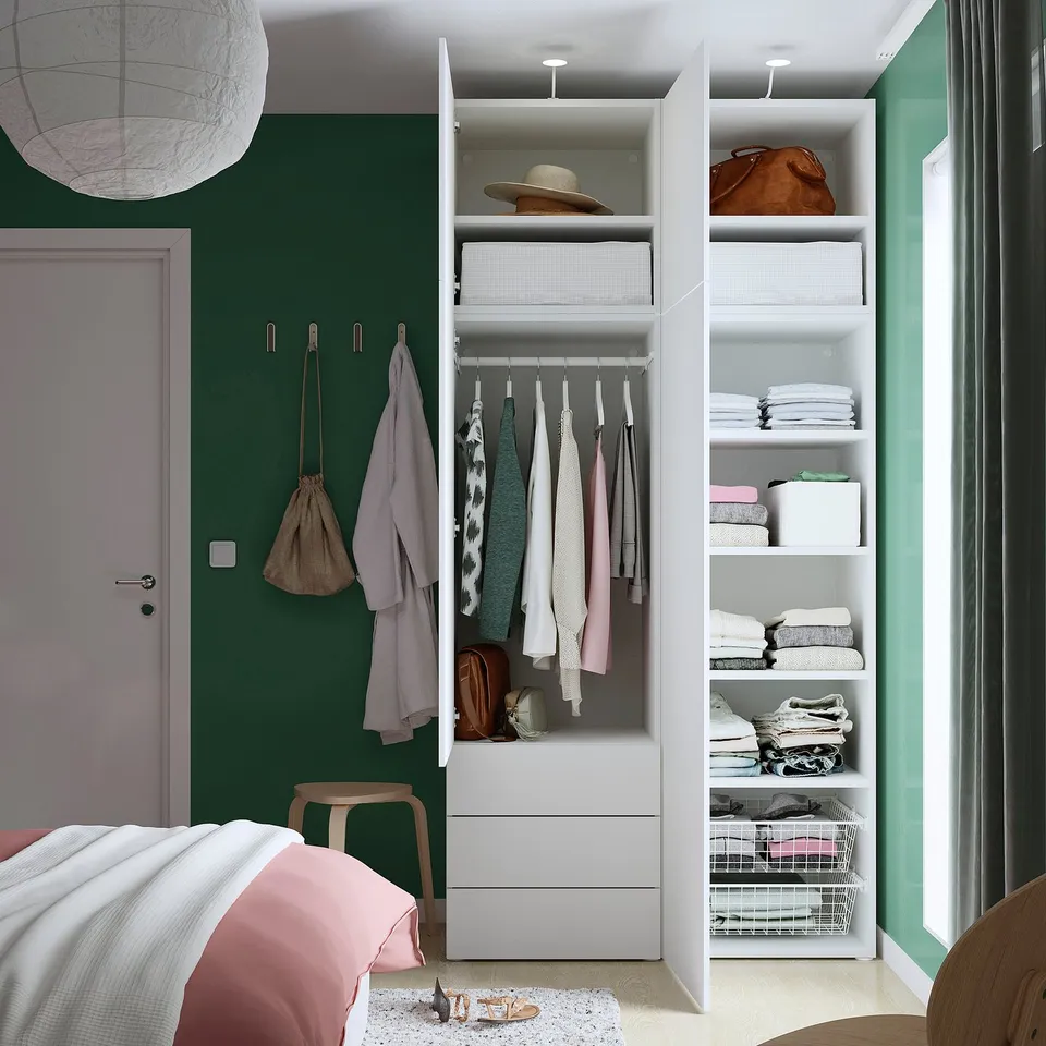 Close wardrobe showing hangers, shelves, and drawers; includes room for clothes, bags, and accessories.