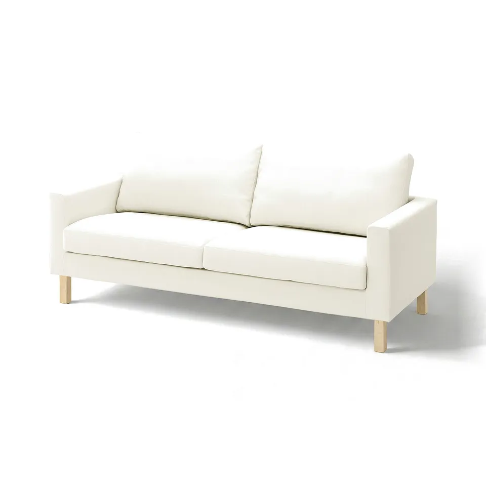 A white SALTSJÖBADEN sofa with wooden legs, featuring clean lines and a modern design.