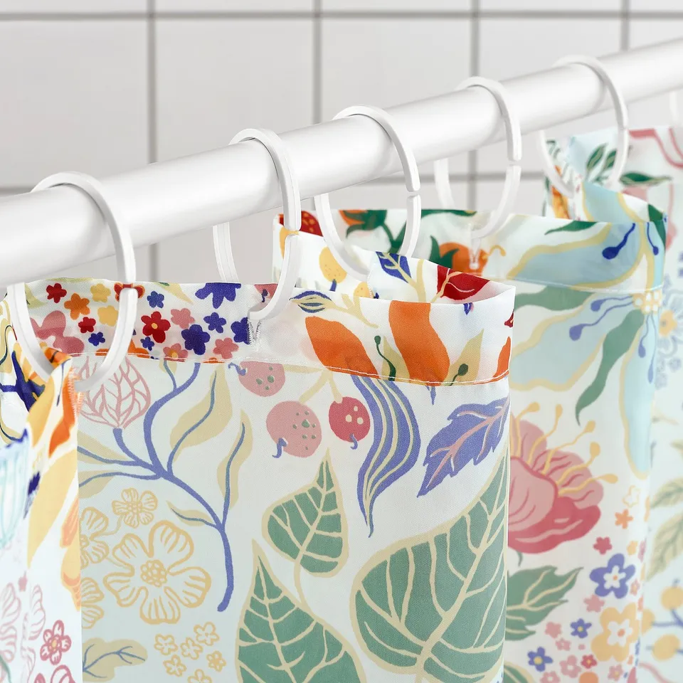 Visual: colourful floral shower curtain hangs with white hooks. Shows water-repellent and fresh pattern.