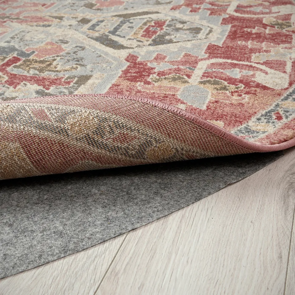 Rug with intricate pastel patterns. Soft, durable, and stain-resistant surface. Fits various flooring types, ideal for high-traffic areas.