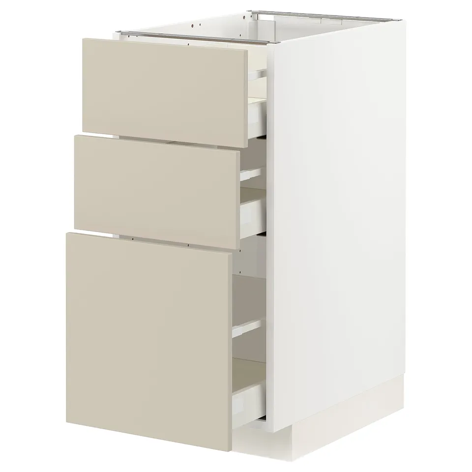 Beige METOD kitchen unit with three drawers, sleek modern design.