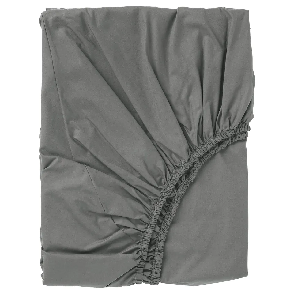 Grey ULLVIDE bed sheet, rectangular with elastic ruffled edges.