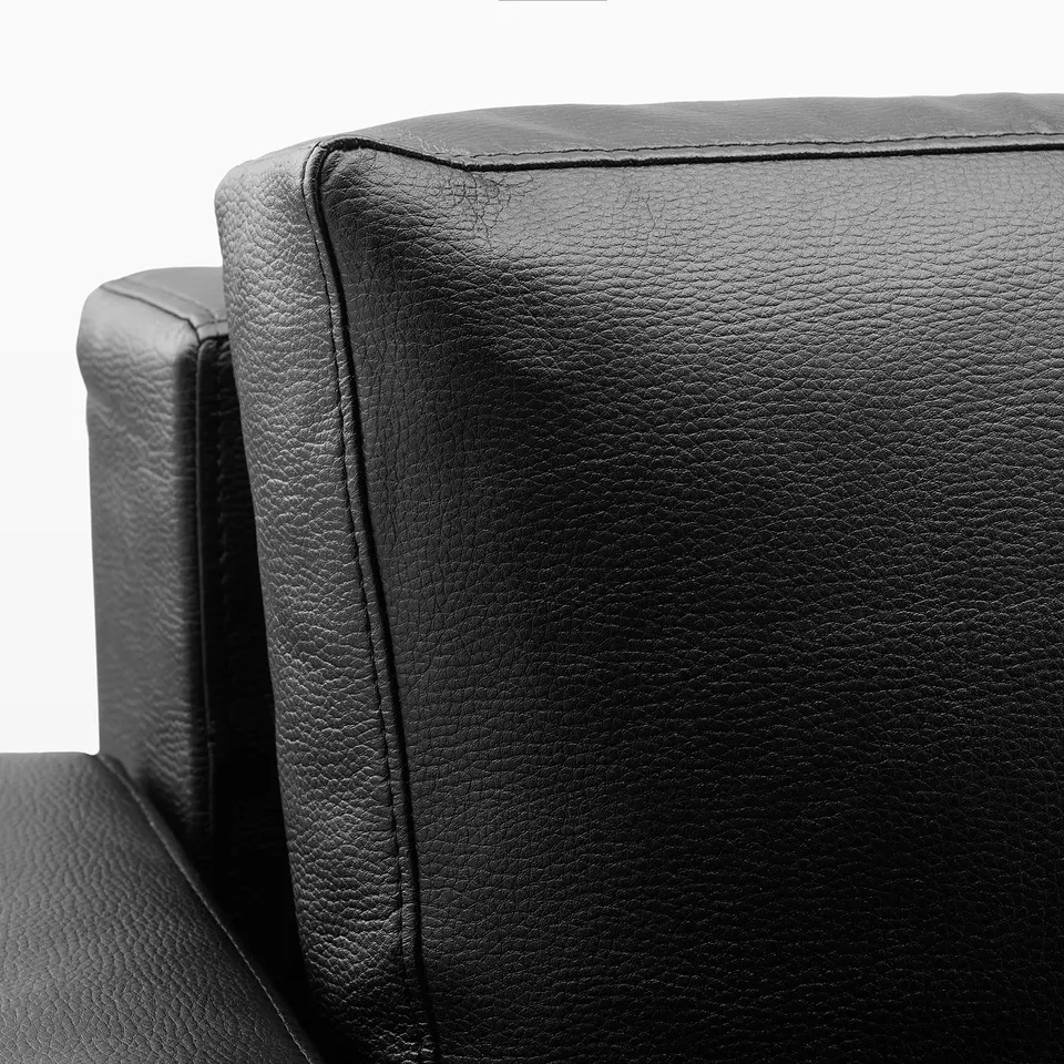 Office chairs with sturdy backs, black padded fabric.