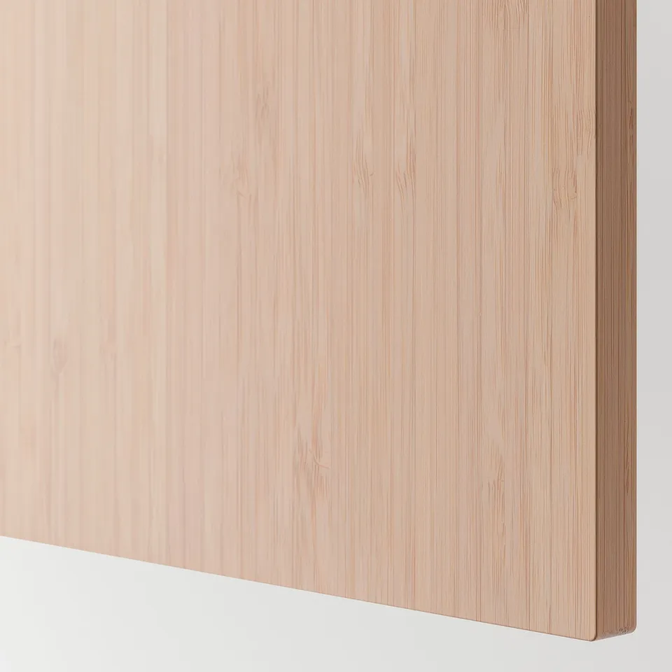 Light wooden panel detail, smooth and natural texture, part of modern furniture.