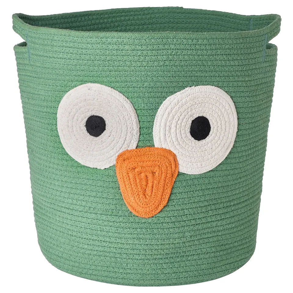This image a green owl-shaped storage basket made from 100% cotton, perfect for storing toys or laundry.