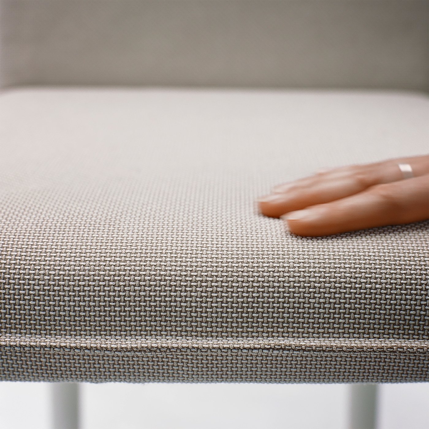 Close-up of TONSTAD chair upholstery, showcasing soft, woven fabric and smooth surface texture.