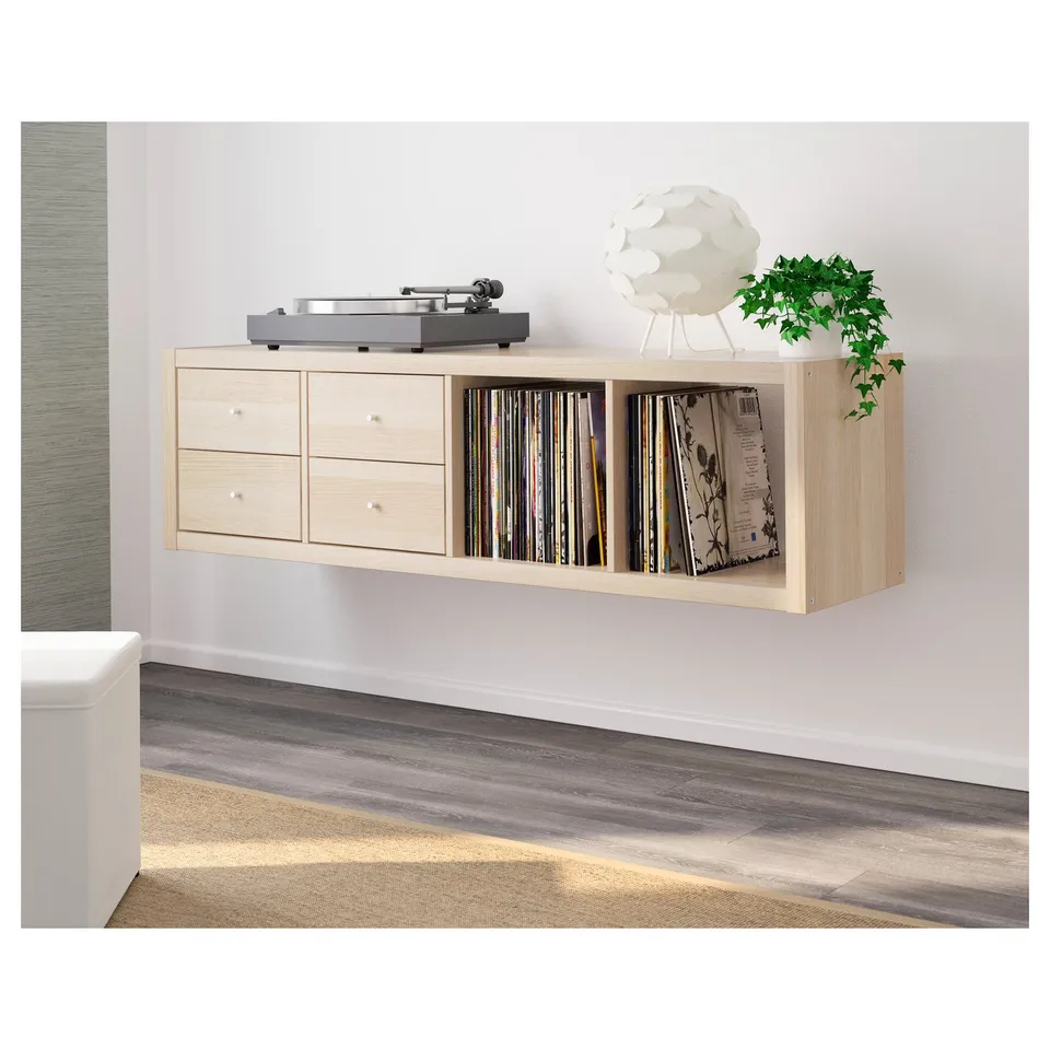 Wooden wall-mounted shelf with drawers and vinyl records. Perfect for compact, organised storage.