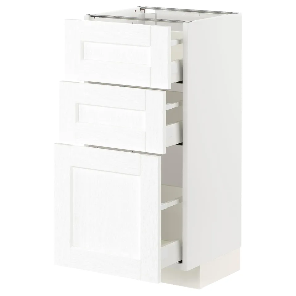 A white METOD kitchen cabinet with multiple drawers.