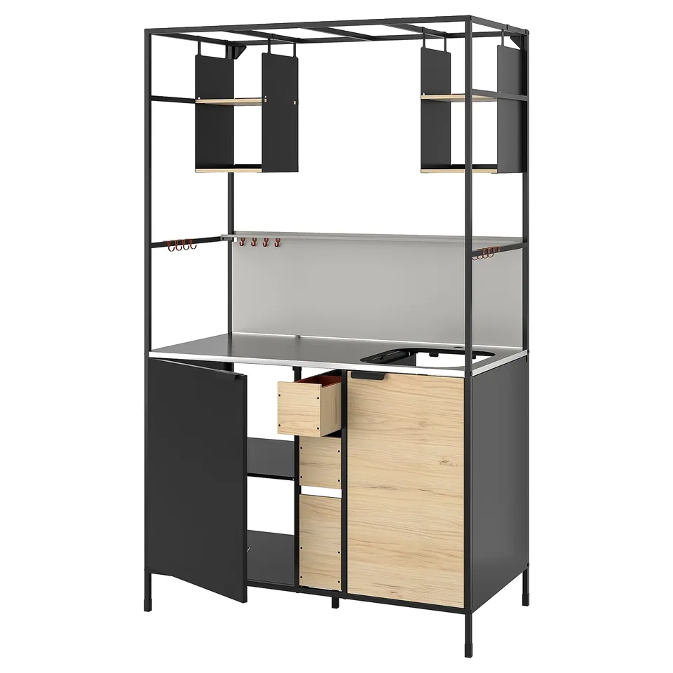 Modern black ÄSPINGE kitchenette with light wooden accents, featuring open shelves, adjustable storage, and a stainless steel countertop.