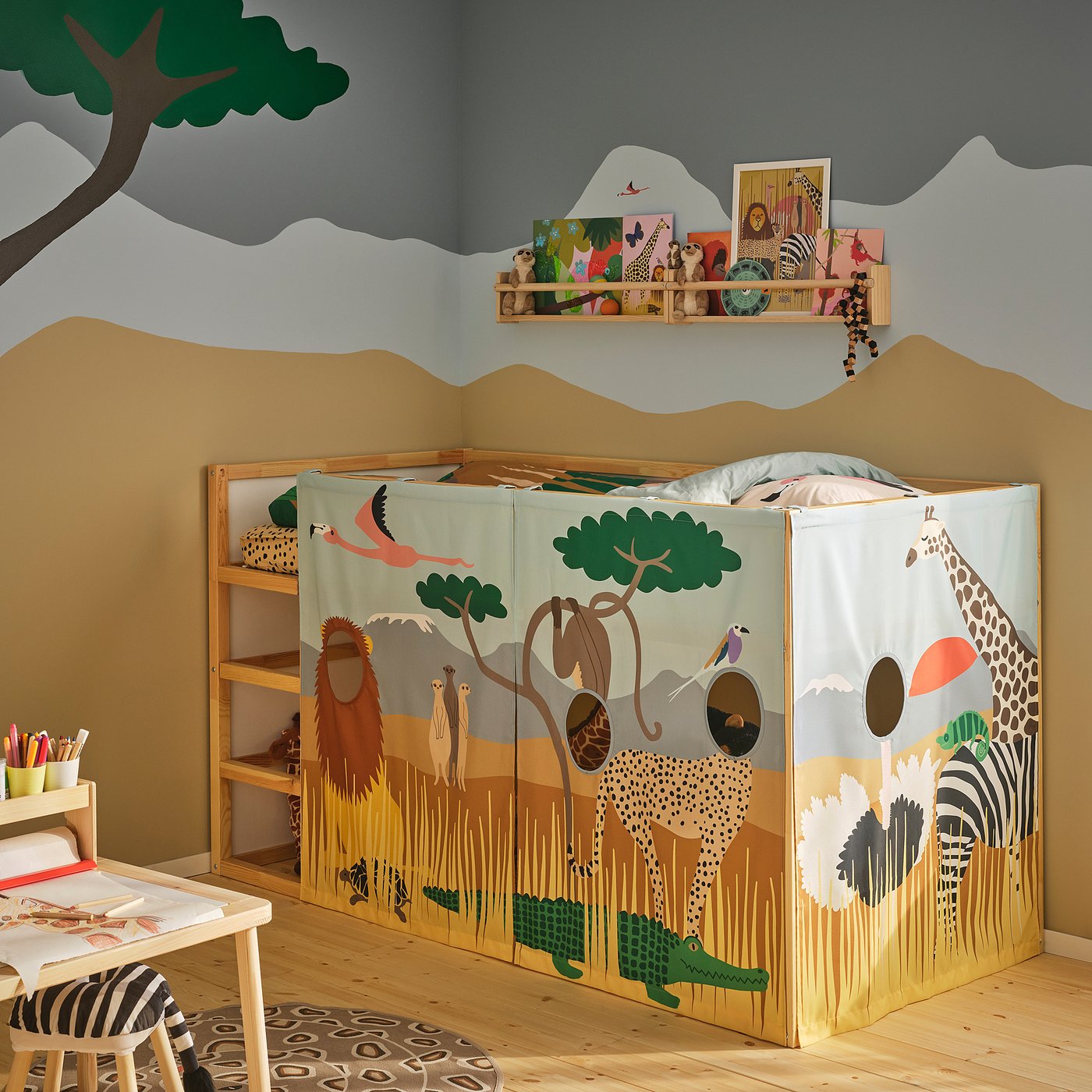 KURA bed with safari curtain, desk, zebra stool & tree mural.