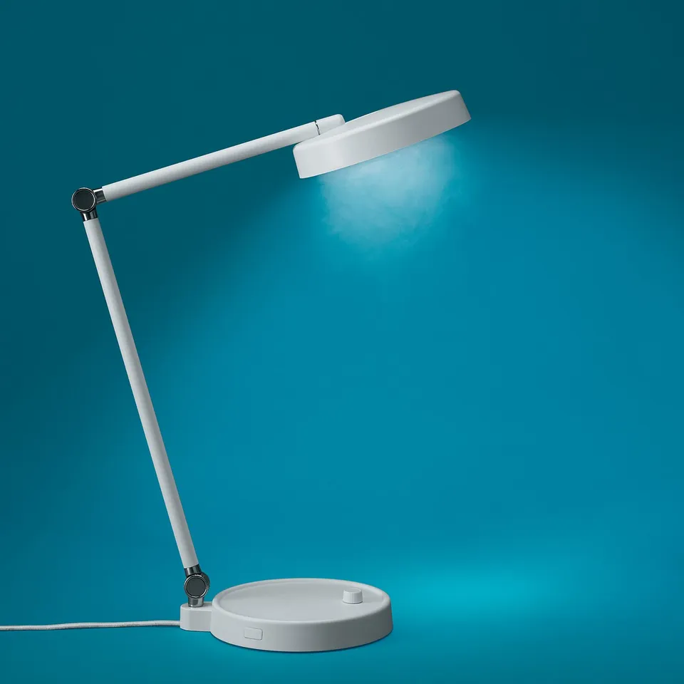 White adjustable desk lamp with flexible arm, bright light on blue background.