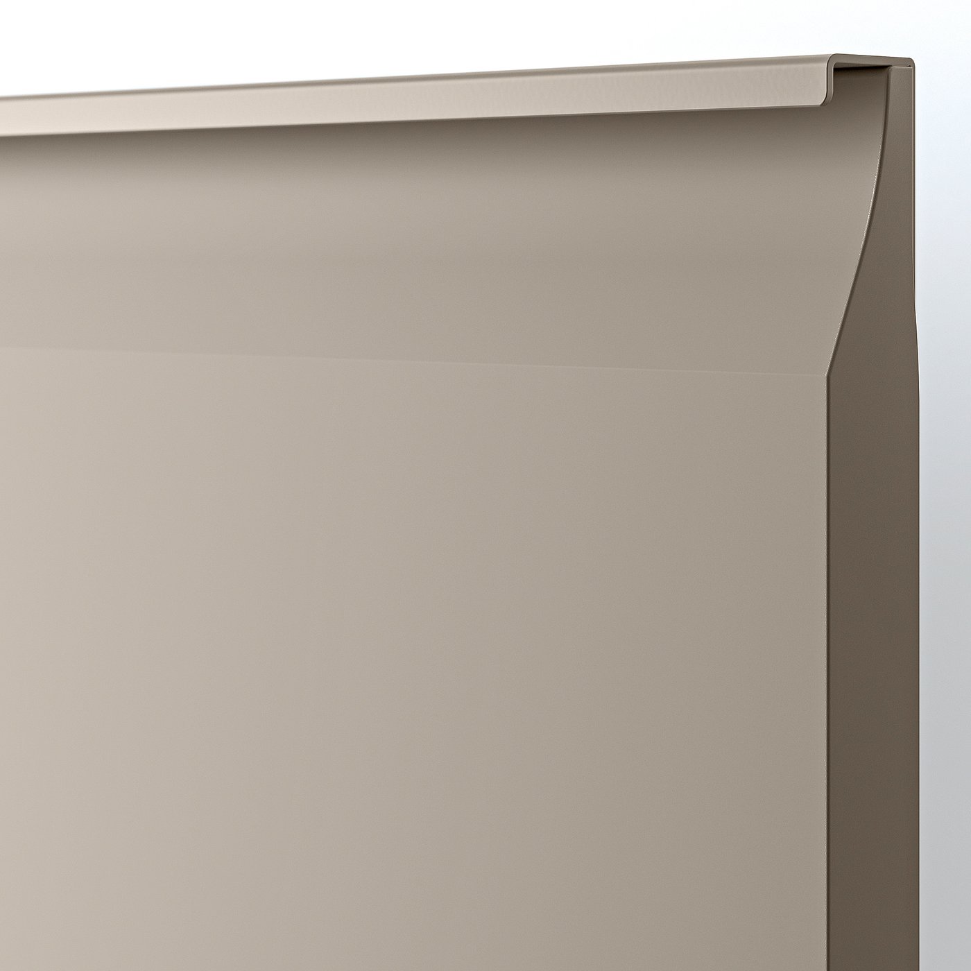 Close-up of sleek, matt beige kitchen cabinet with smooth edges.