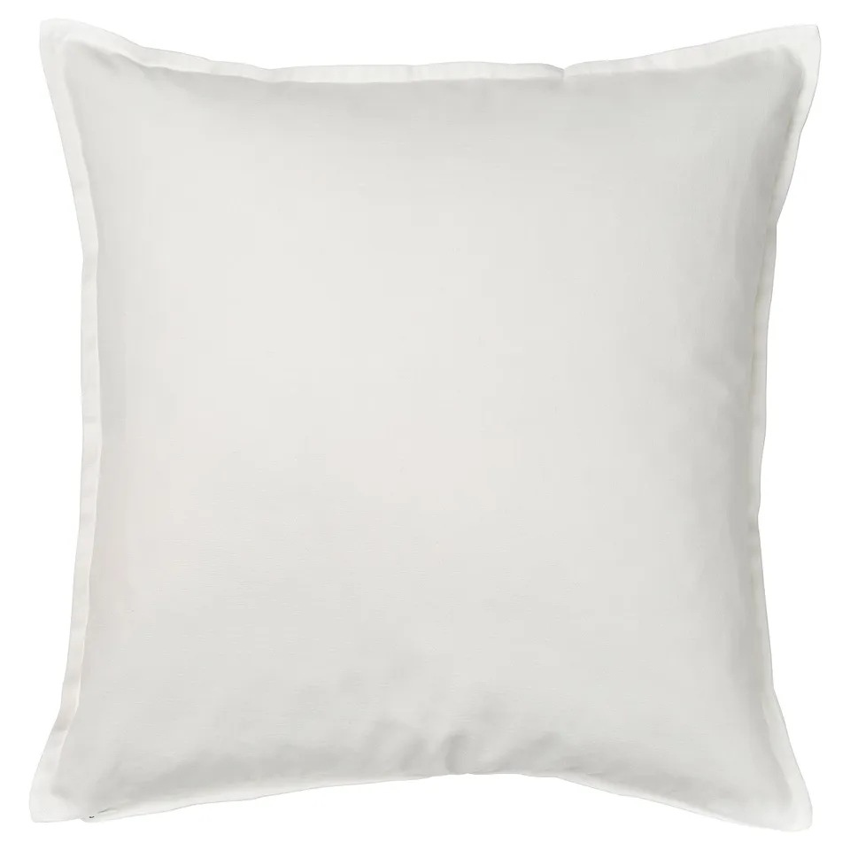 A white, square FACELIOR cushion cover with intricate embroidered floral design, made from 100% cotton.