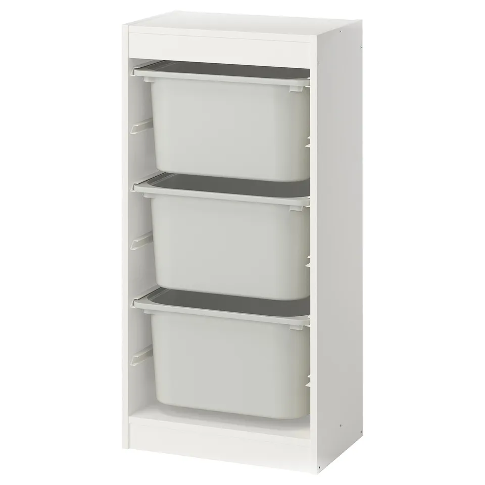 A white TROFAST storage unit with three removable grey bins for organising items.