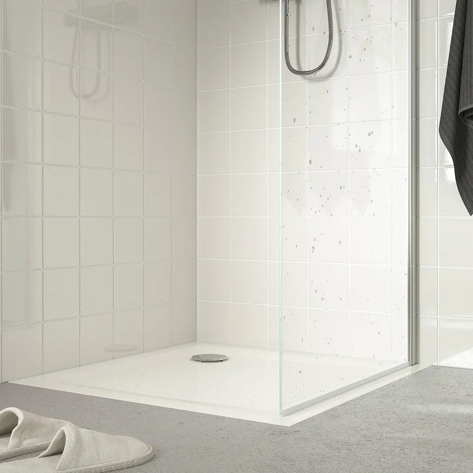 Small, modern shower tray with anti-slip floor, designed for easy access and water efficiency.