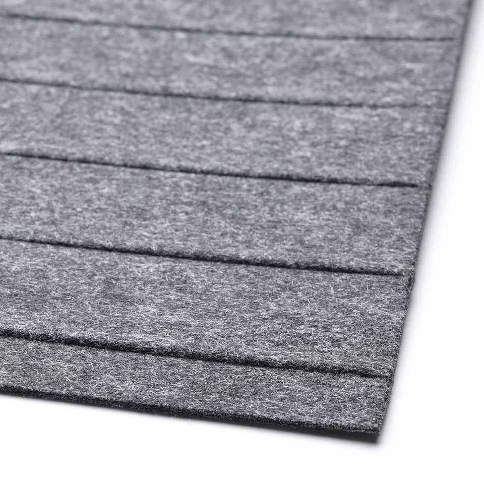 Close-up of grey drawer mat, textured, soft surface, designed to reduce noise & prevent scratches.