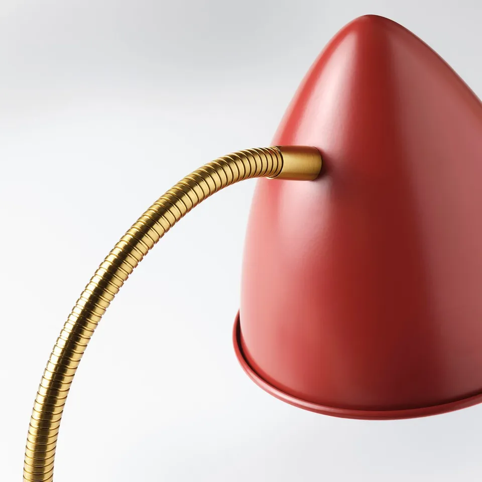 Modern red desk lamp with flexible gold gooseneck, high-quality finish and led technology for efficient lighting.