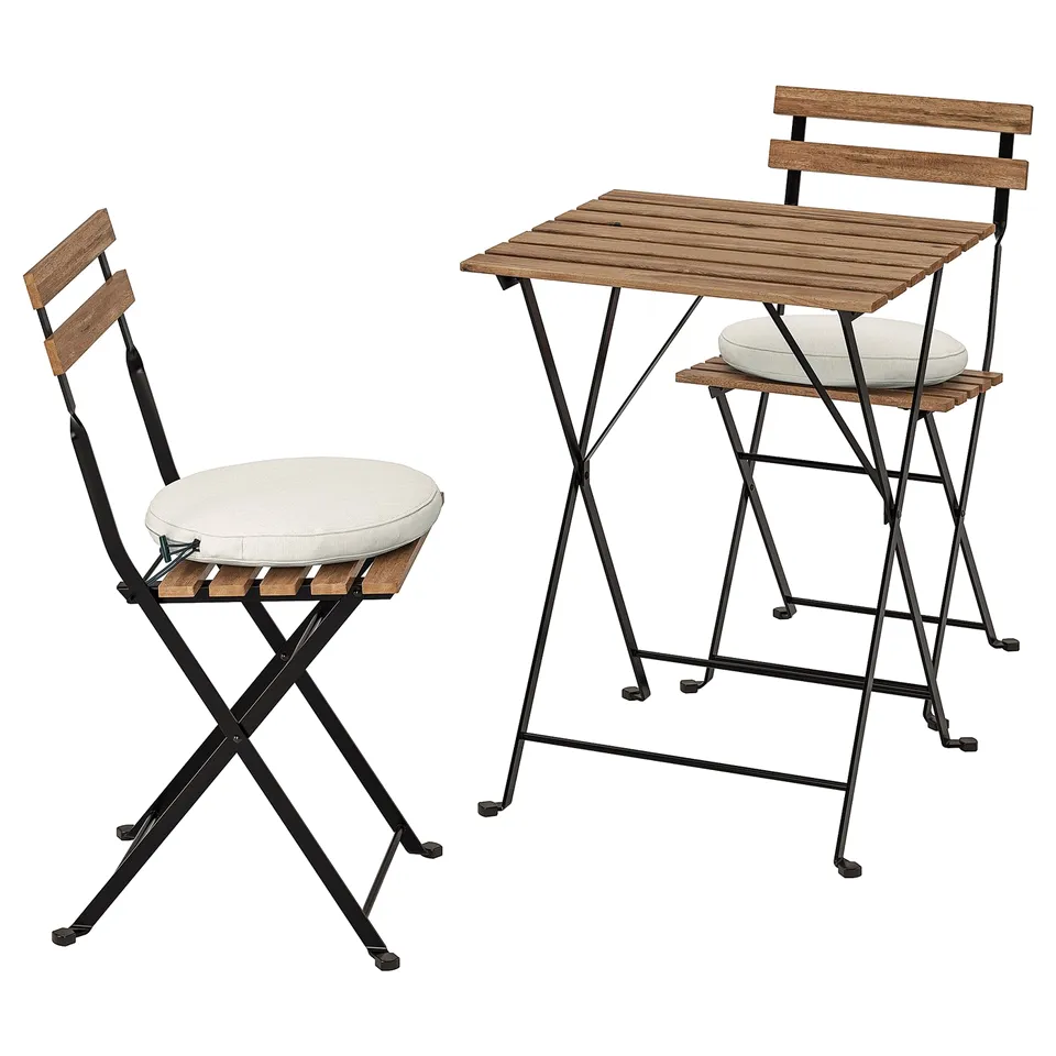 TÄRNÖ: 2 chairs with cushions and table. Black metal, wood. Outdoor set, foldable.