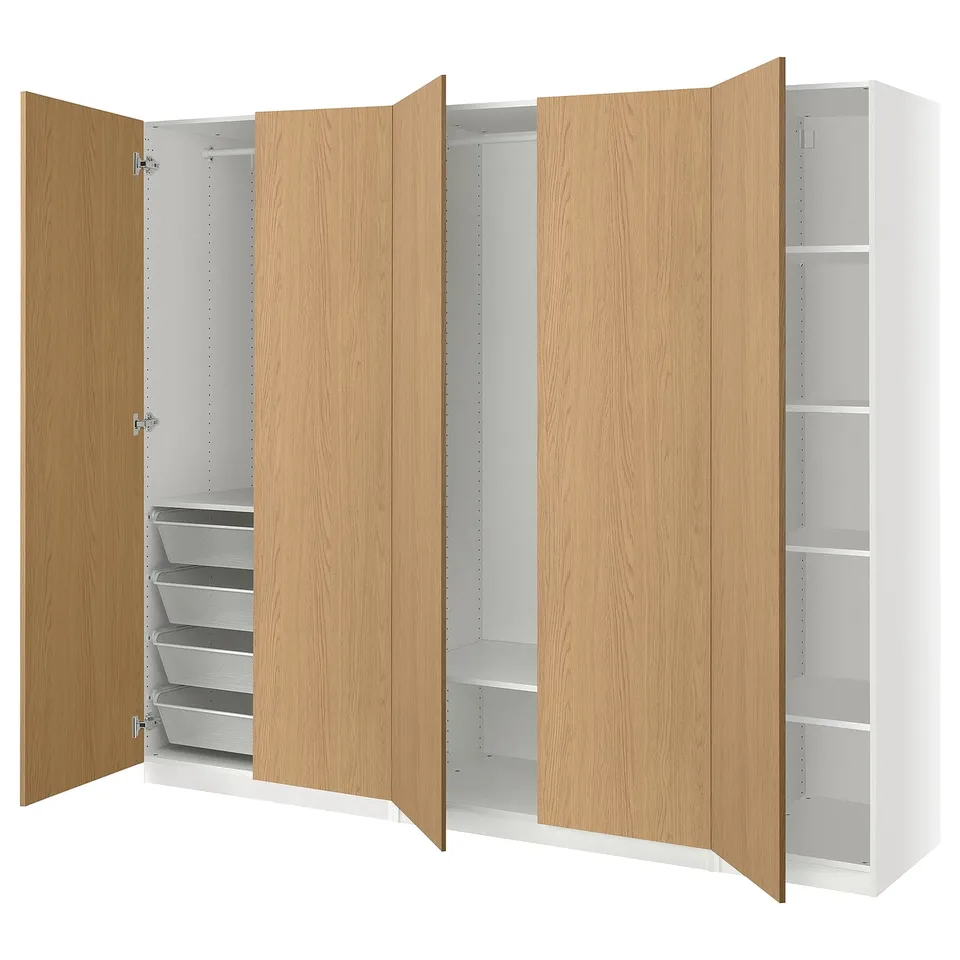 An open wooden PAX wardrobe with shelves and drawers.