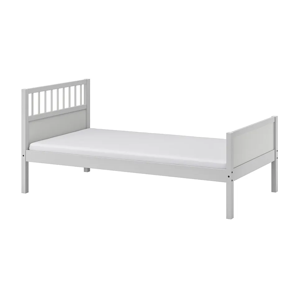 White wooden bed, rectangular, simple design, sturdy, solid pine frame.