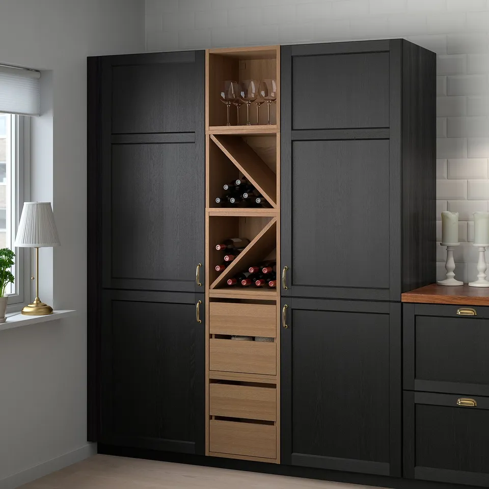 VADHOLMA wine cabinet with wooden drawers and shelves, holding bottles and glasses, near window with lamp.