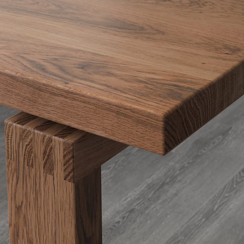 Close-up of high-quality wood table edge, showcasing smooth, natural oak texture and sturdy construction.